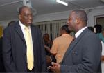 Dr. James (l), Minister of Health Donville Inniss (r) - Image/Barbados Advocate