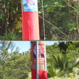 The posters of DLP candidate John Boyce and BLP Jerome candidate guard the area